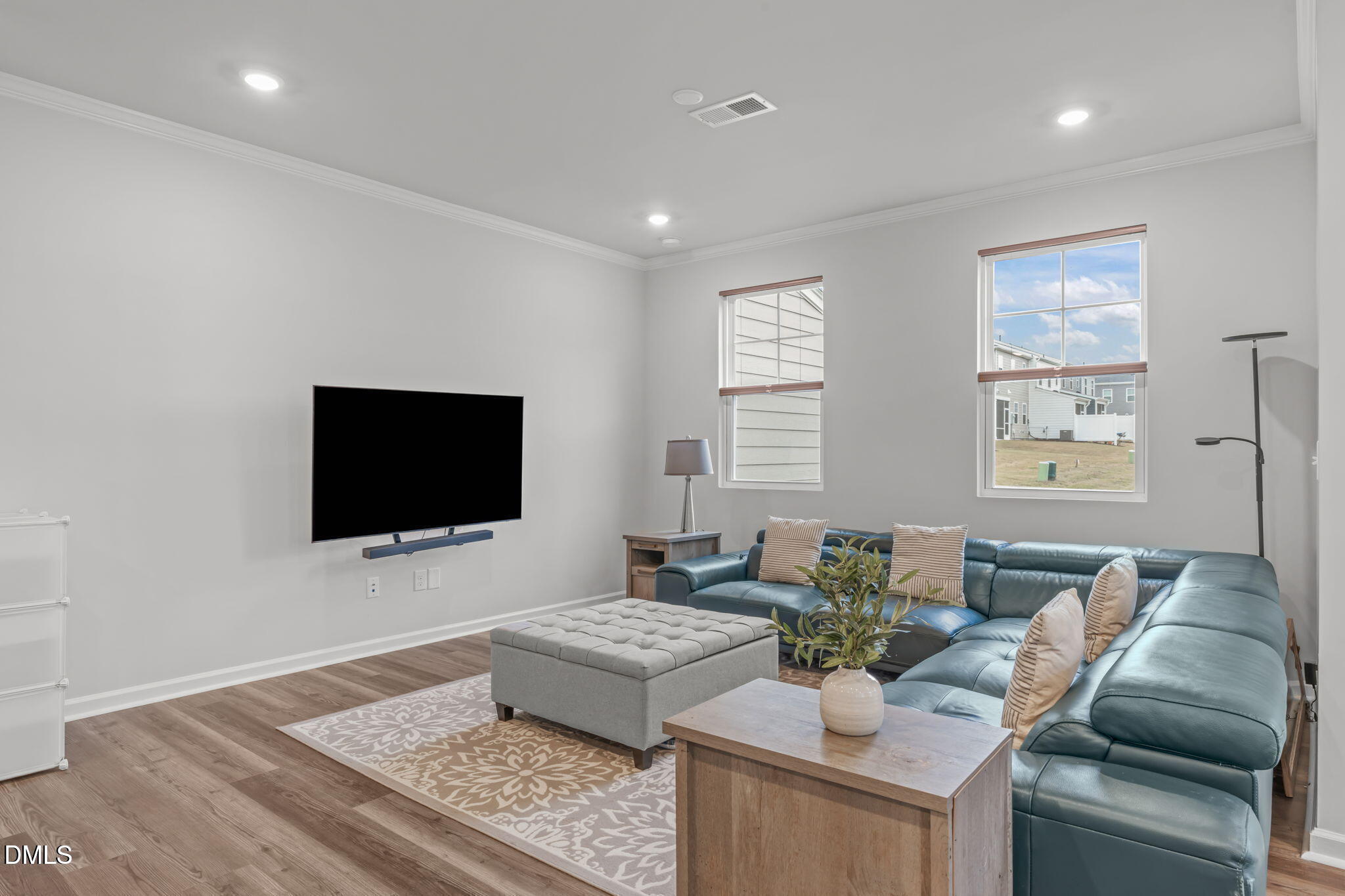 1809 Barrett Run Trail Apex, NC 27502 - Photo 10 of 23 a living room with furniture and a flat screen tv