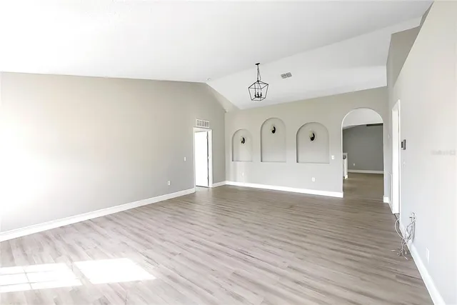 a view of a livingroom with wooden floor