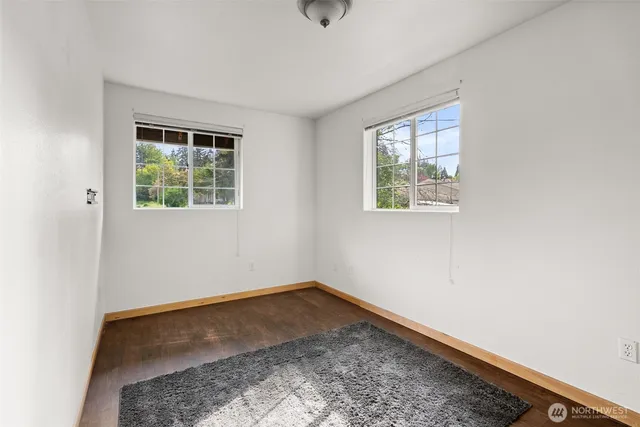 a view of balcony with furniture and wooden floor