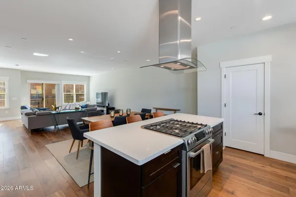 a kitchen that has a table and chairs in it