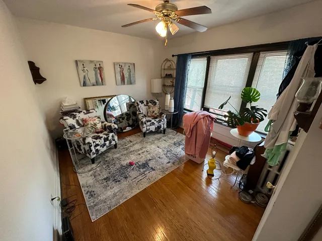 a bathroom with a sink and mirror with toilet