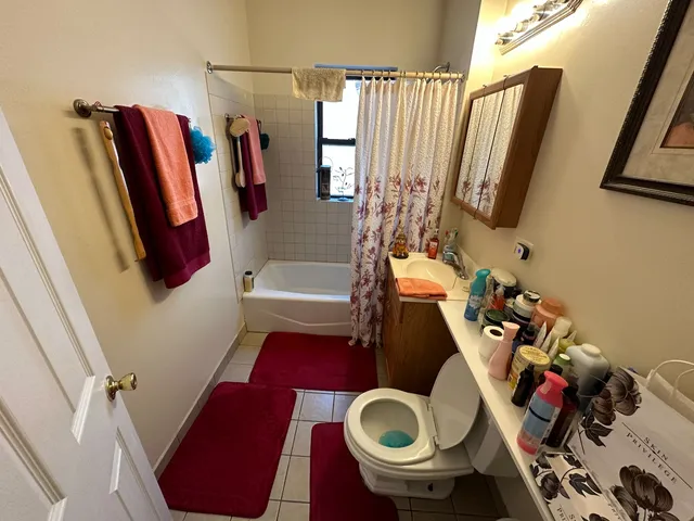 a view of living room with furniture and a mirror
