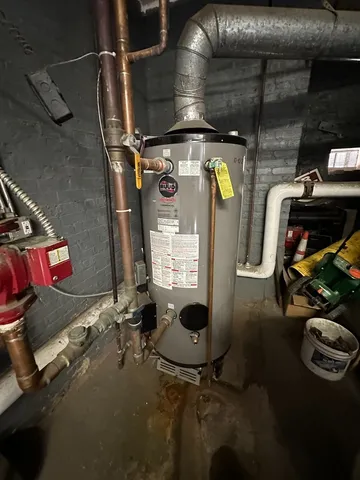 a front view of a house with barbeque and wooden floor