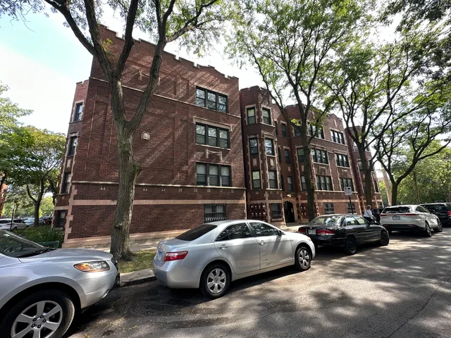 a view of a cars parked in front of a building