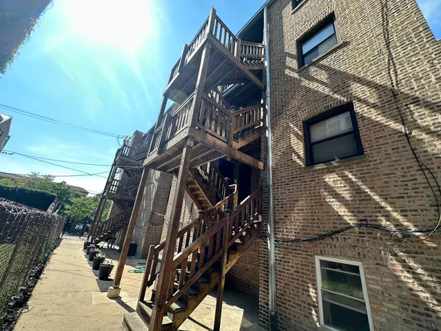 a view of a porch with wooden floor