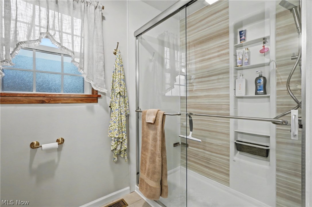 4556 Rootstown Road Ravenna, OH 44266 - Photo 20 of 50 Bathroom featuring a stall shower and baseboards