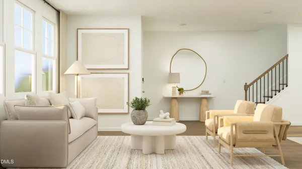 a living room with furniture a window and a lamp