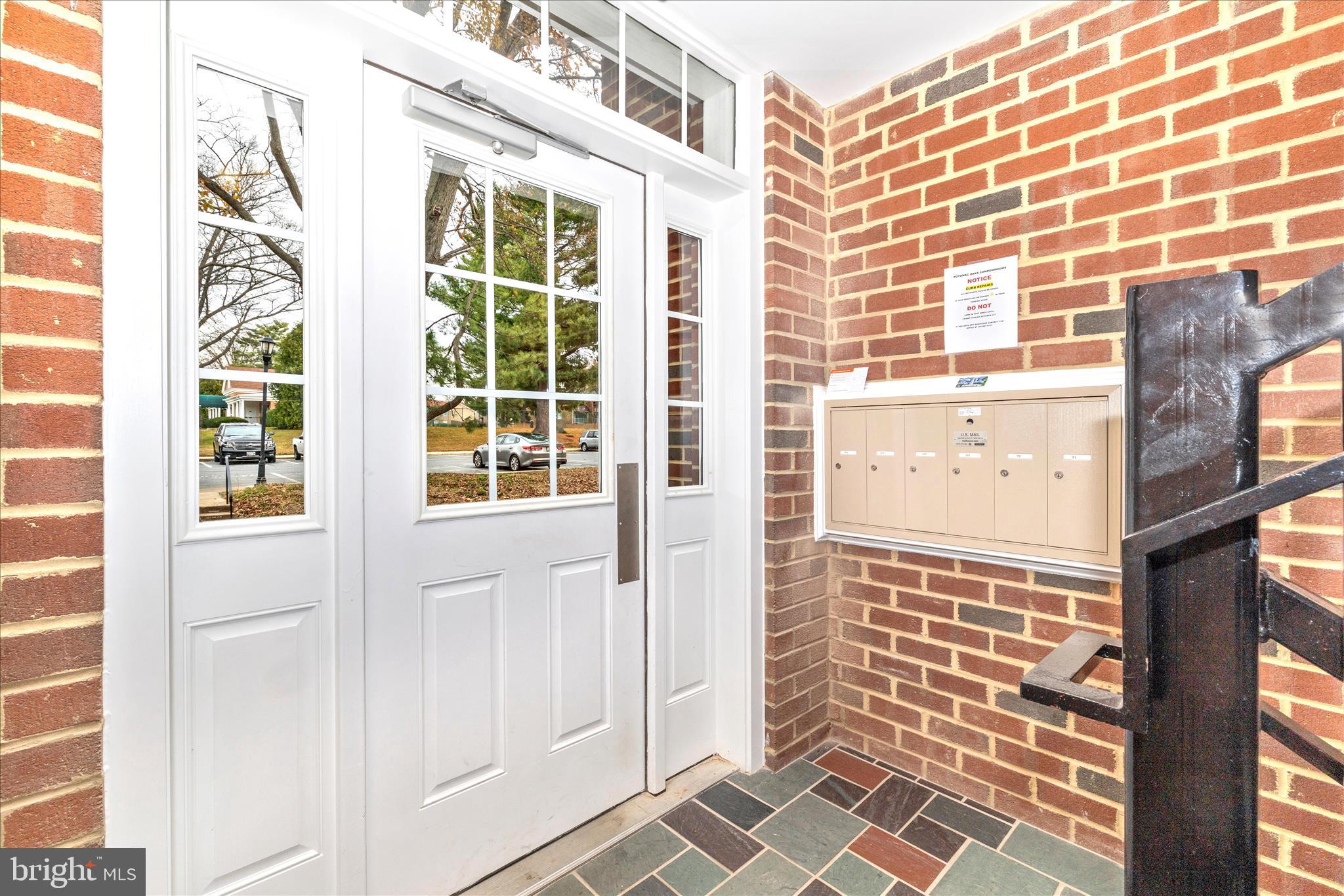 828 Quince Orchard Boulevard, Unit 82820 Gaithersburg, MD 20878 - Photo 3 of 51 a view of front door of house