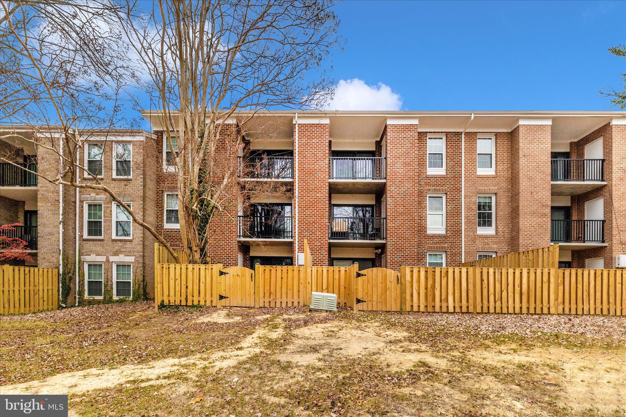 828 Quince Orchard Boulevard, Unit 82820 Gaithersburg, MD 20878 - Photo 49 of 51 a front view of a building with a street
