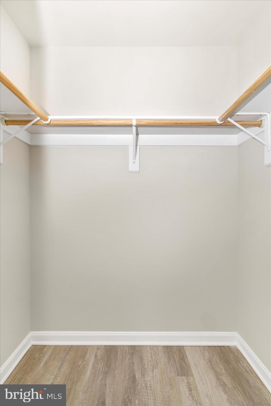 828 Quince Orchard Boulevard, Unit 82820 Gaithersburg, MD 20878 - Photo 9 of 51 a view of a room with racks on the wall