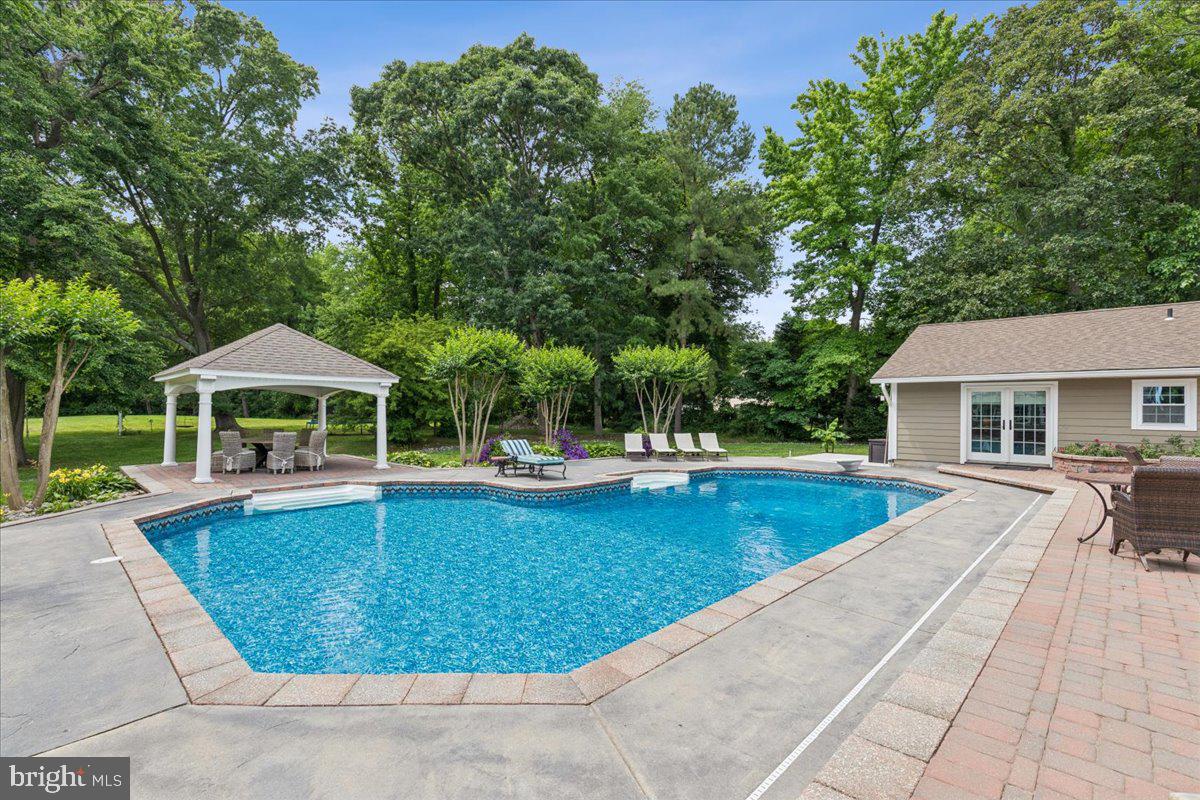 102 Little Neck Road Stevensville, MD 21666 - Photo 57 of 77 a view of a house with swimming pool and sitting area