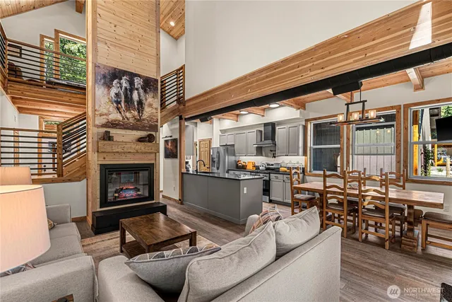 a view of a patio with couches chairs and a fireplace