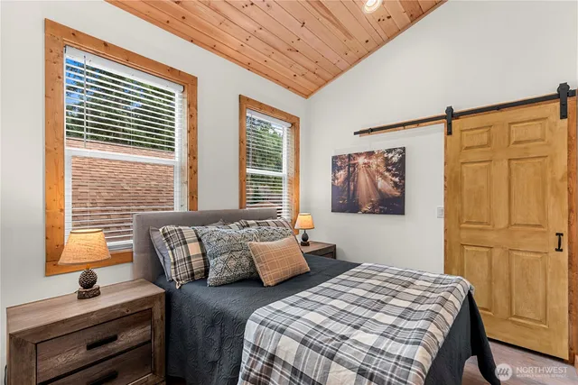 a bedroom with bed and a window