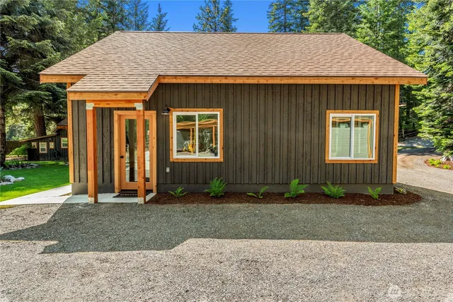 a front view of a house with garden