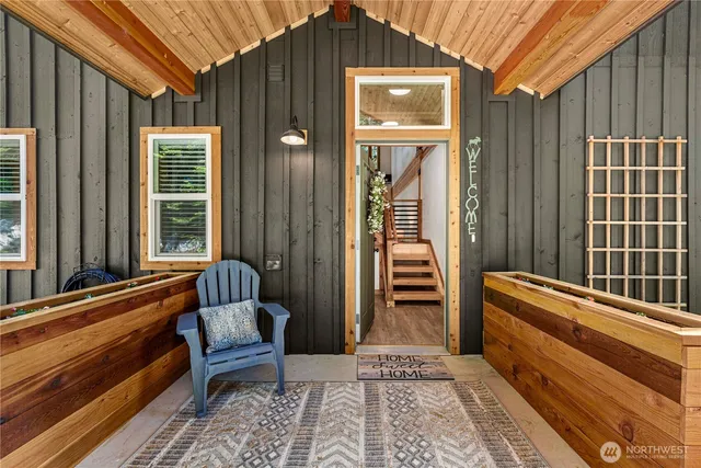 a view of a two chairs in the balcony