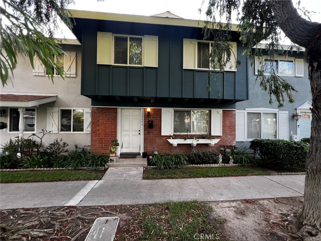 19844 Inverness Lane Huntington Beach, CA 92646 - Photo 1 of 2 a front view of a house with garden