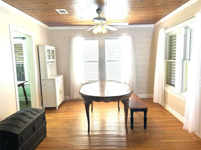 a view of a livingroom with furniture window and wooden floor