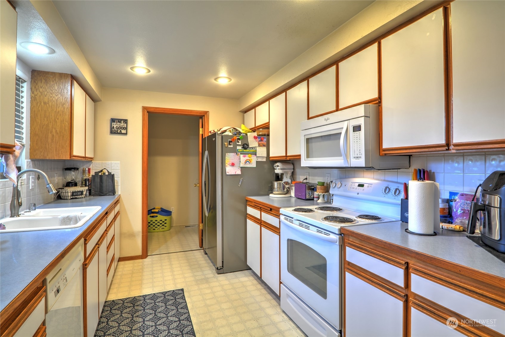 21405 Calhoun Road Monroe, WA 98272 - Photo 15 of 36 a kitchen with stainless steel appliances granite countertop a sink stove and refrigerator