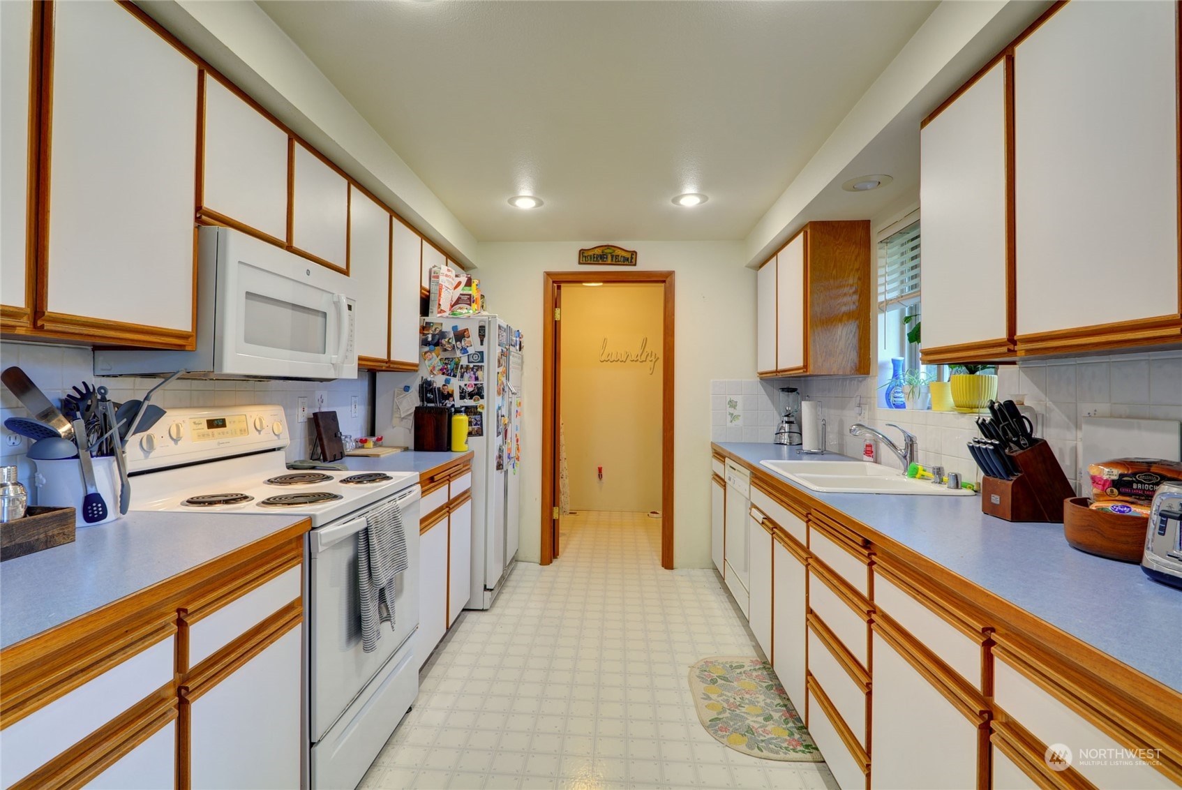 21405 Calhoun Road Monroe, WA 98272 - Photo 26 of 36 a kitchen with stainless steel appliances a stove a sink dishwasher and a refrigerator