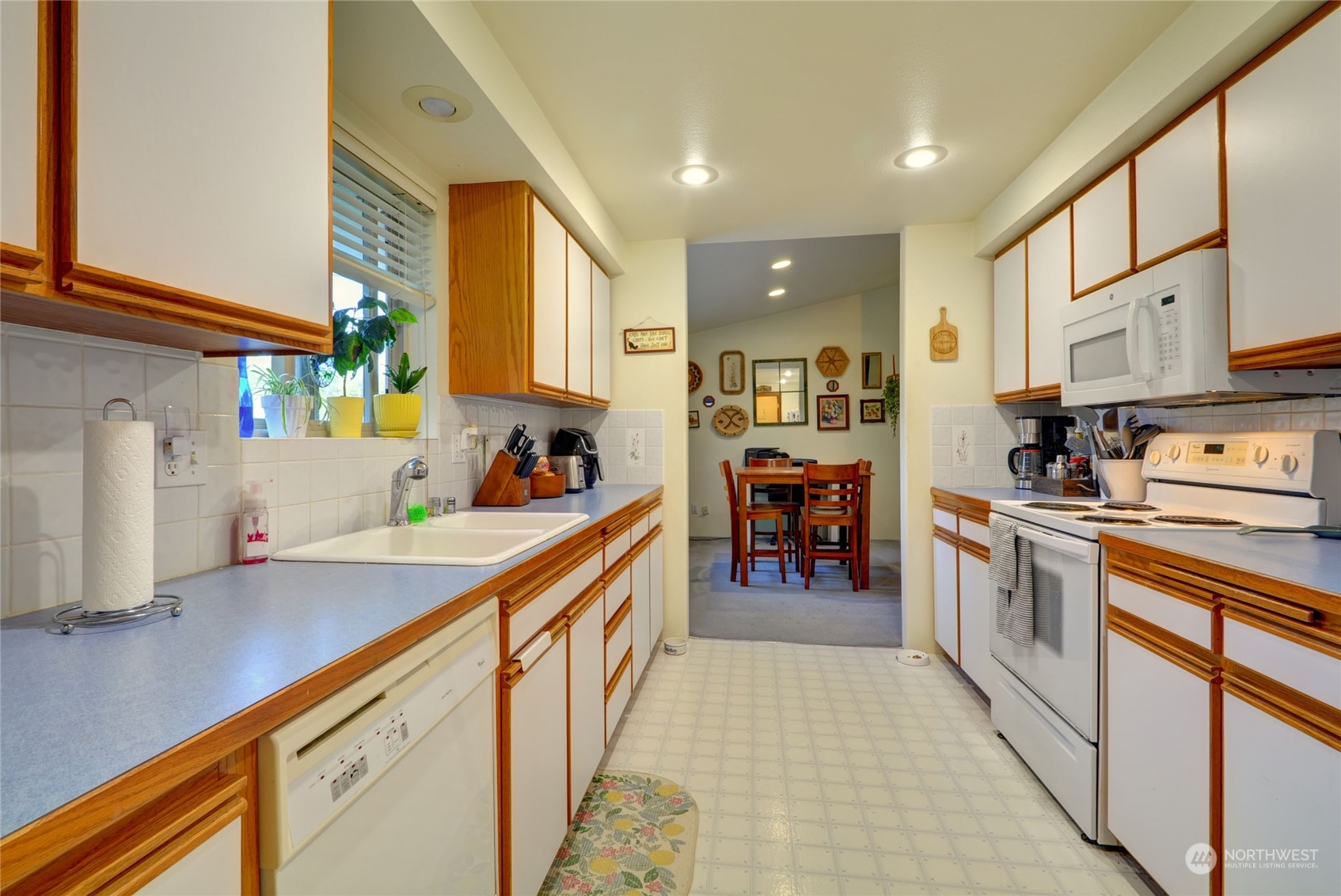 21405 Calhoun Road Monroe, WA 98272 - Photo 27 of 36 a kitchen with stainless steel appliances granite countertop a sink and cabinets