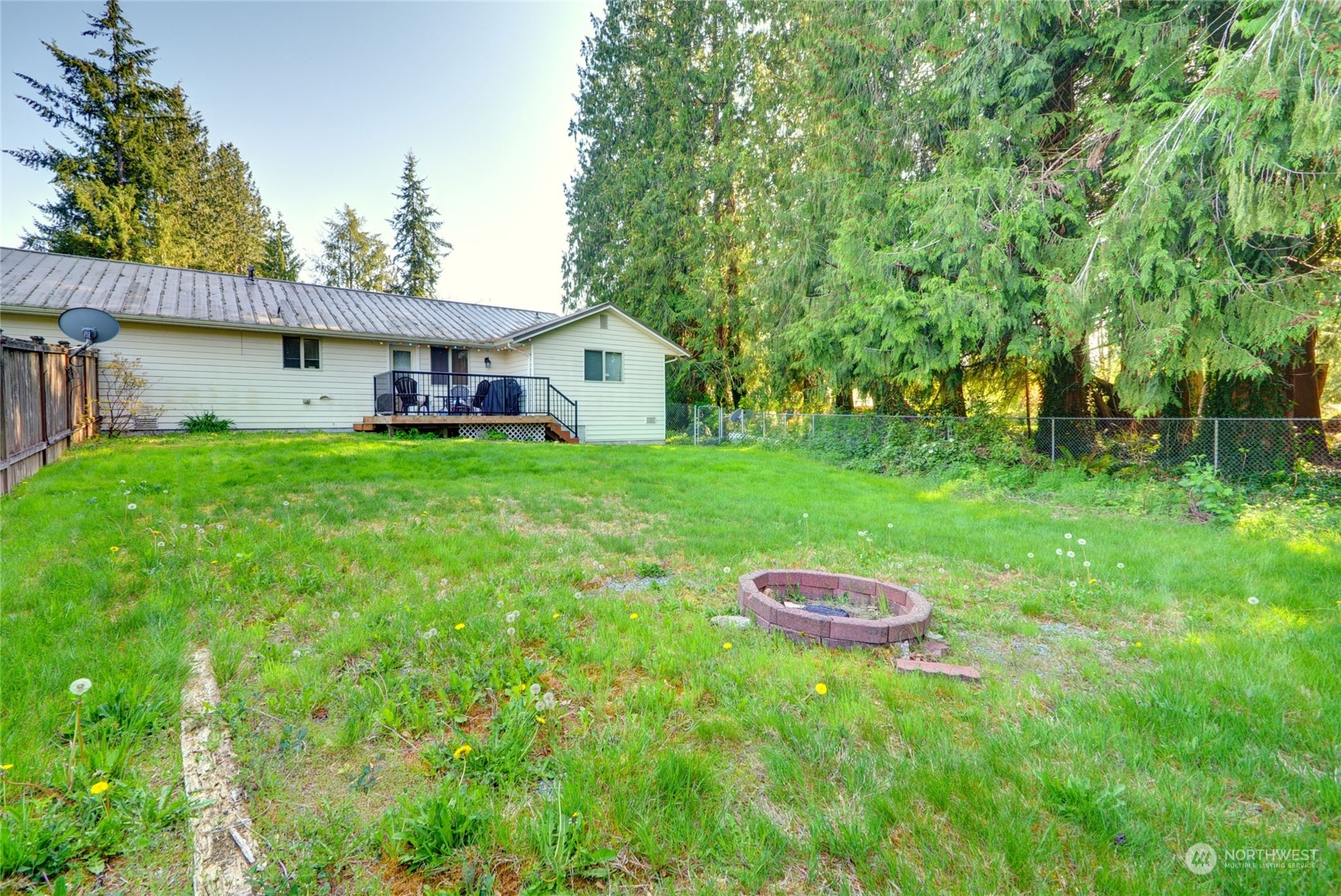 21405 Calhoun Road Monroe, WA 98272 - Photo 10 of 36 a front view of a house with a yard and trees