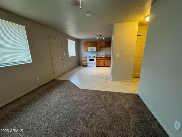 a view of a storage & utility room with closet wooden floor