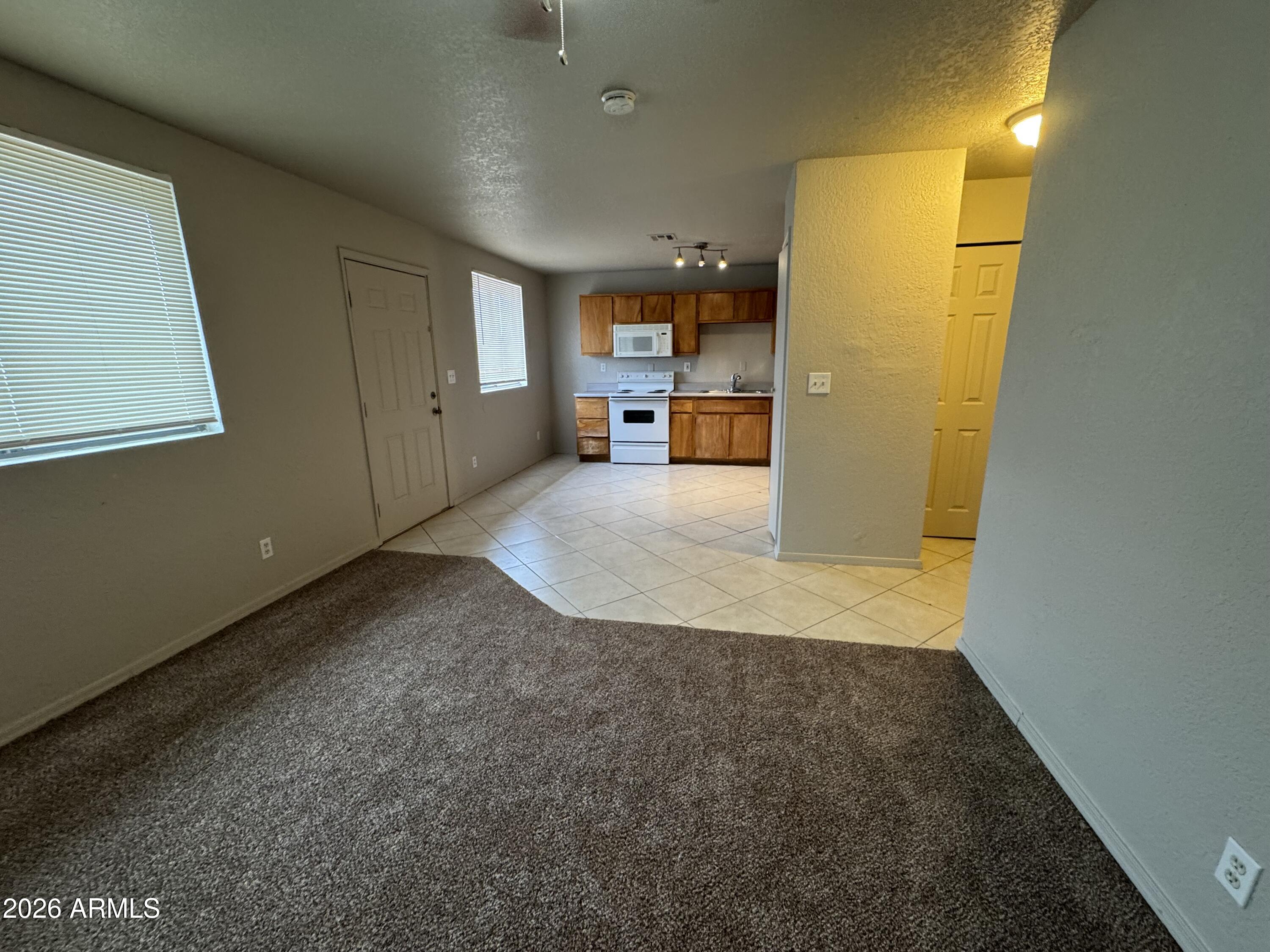 1702 West Shangri-la Road Phoenix, AZ 85029 - Photo 12 of 25 a view of a storage & utility room with closet wooden floor