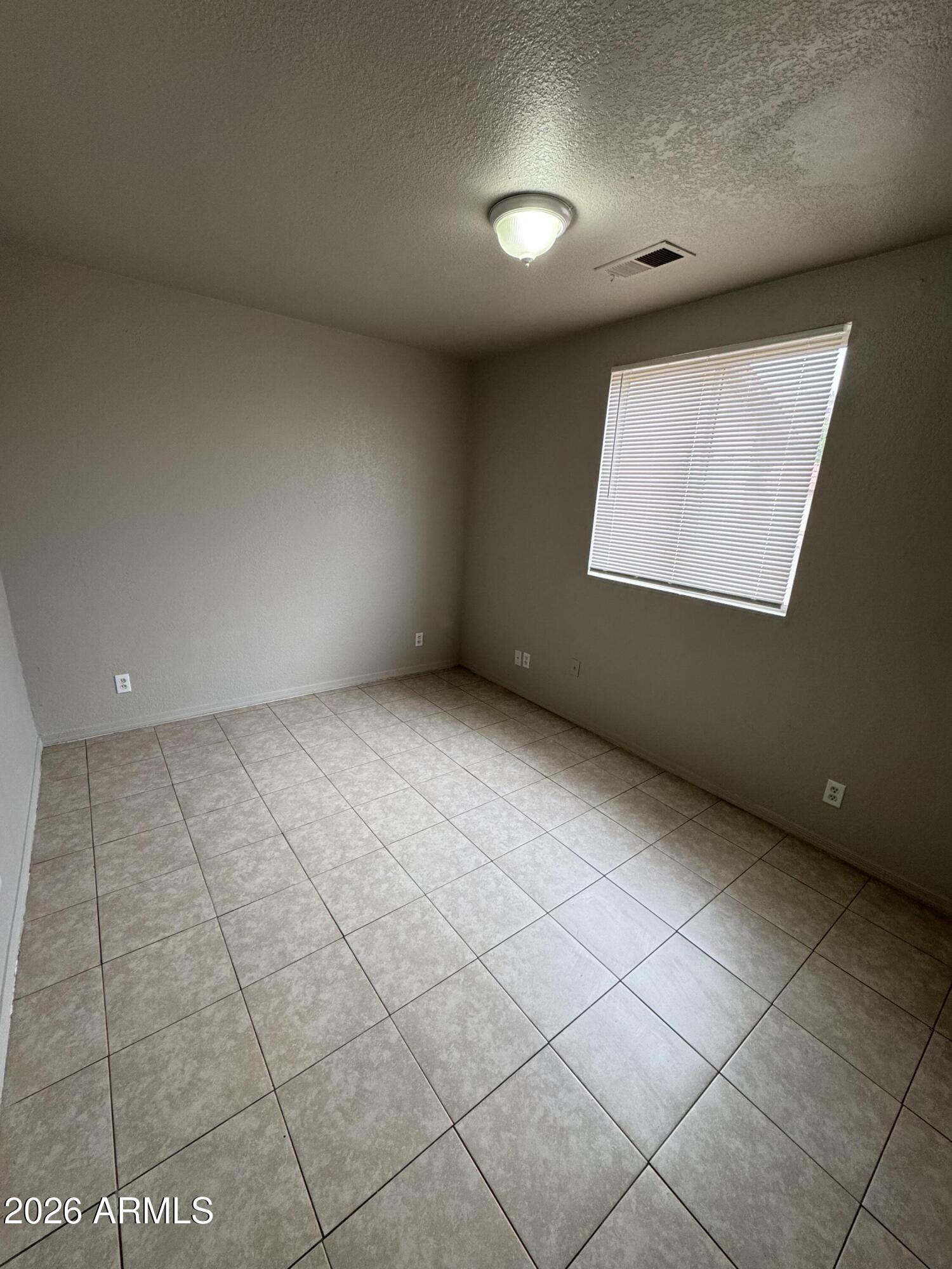 1702 West Shangri-la Road Phoenix, AZ 85029 - Photo 13 of 25 a view of an empty room with a window