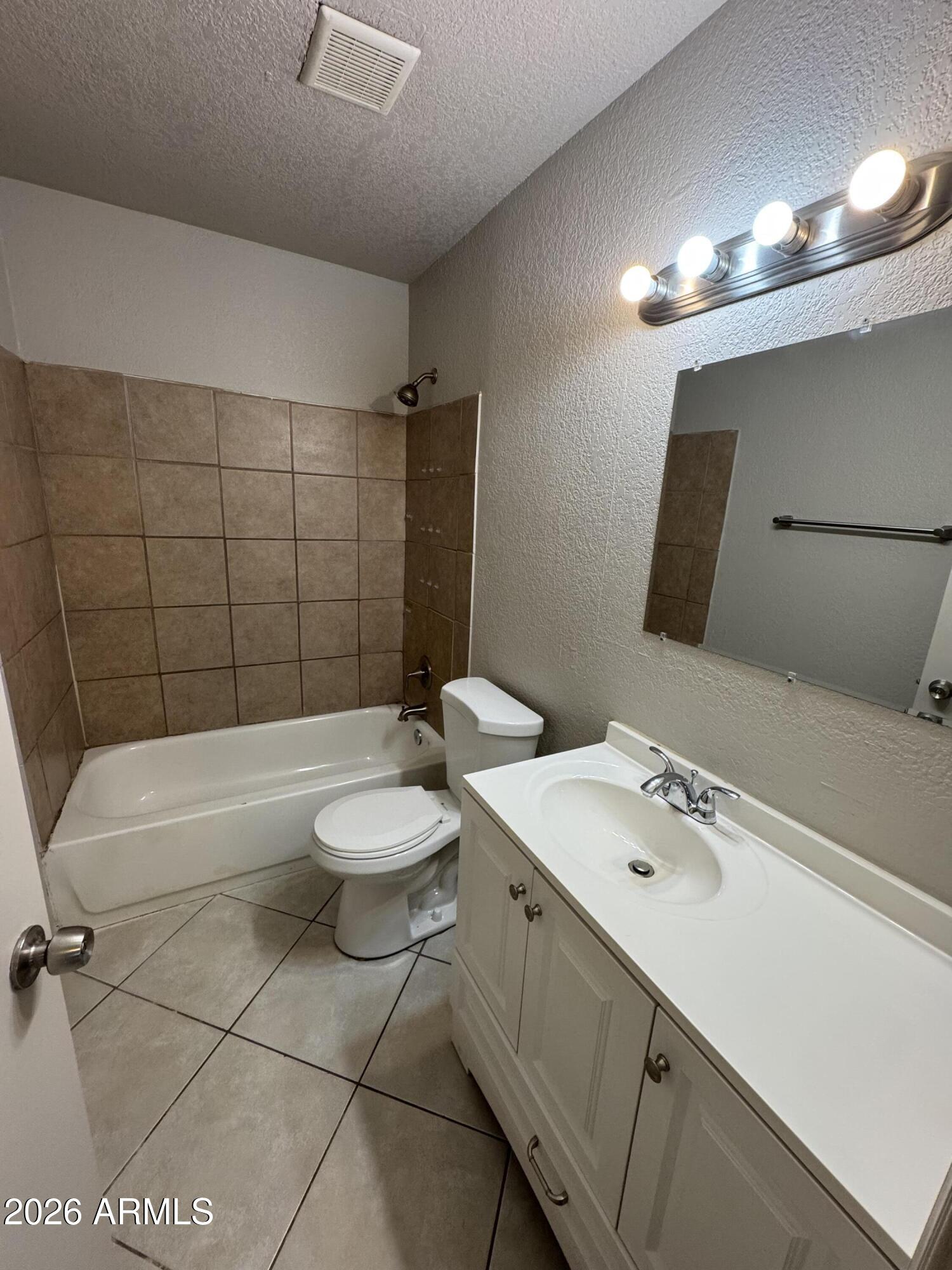 1702 West Shangri-la Road Phoenix, AZ 85029 - Photo 15 of 25 a bathroom with a sink a toilet and shower