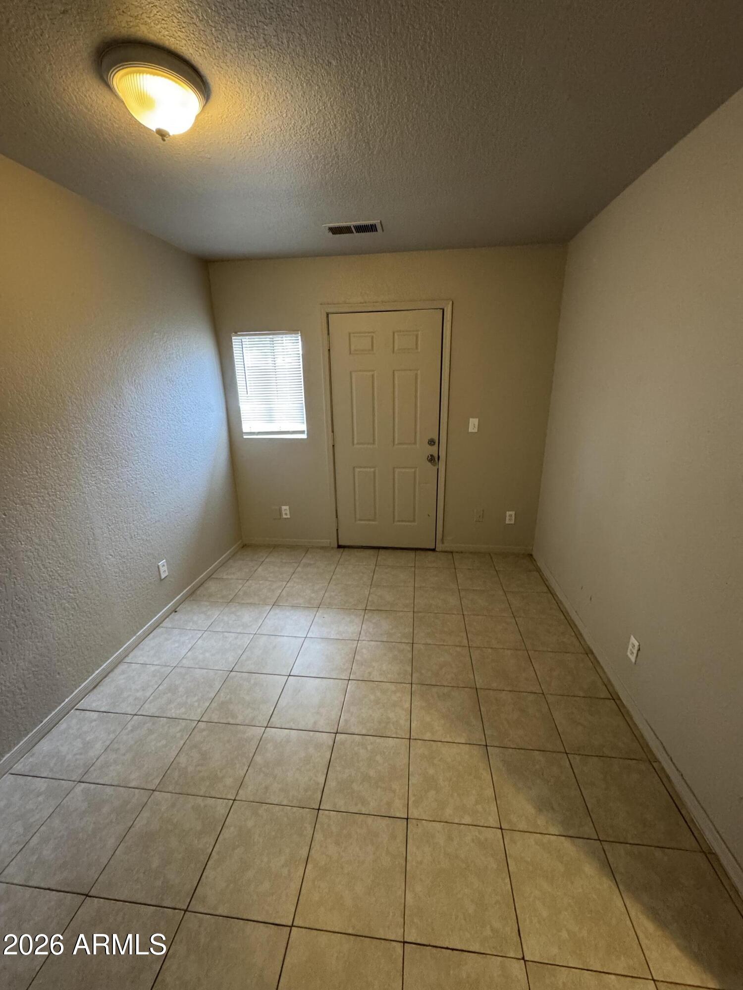 1702 West Shangri-la Road Phoenix, AZ 85029 - Photo 16 of 25 a view of an empty room with a window