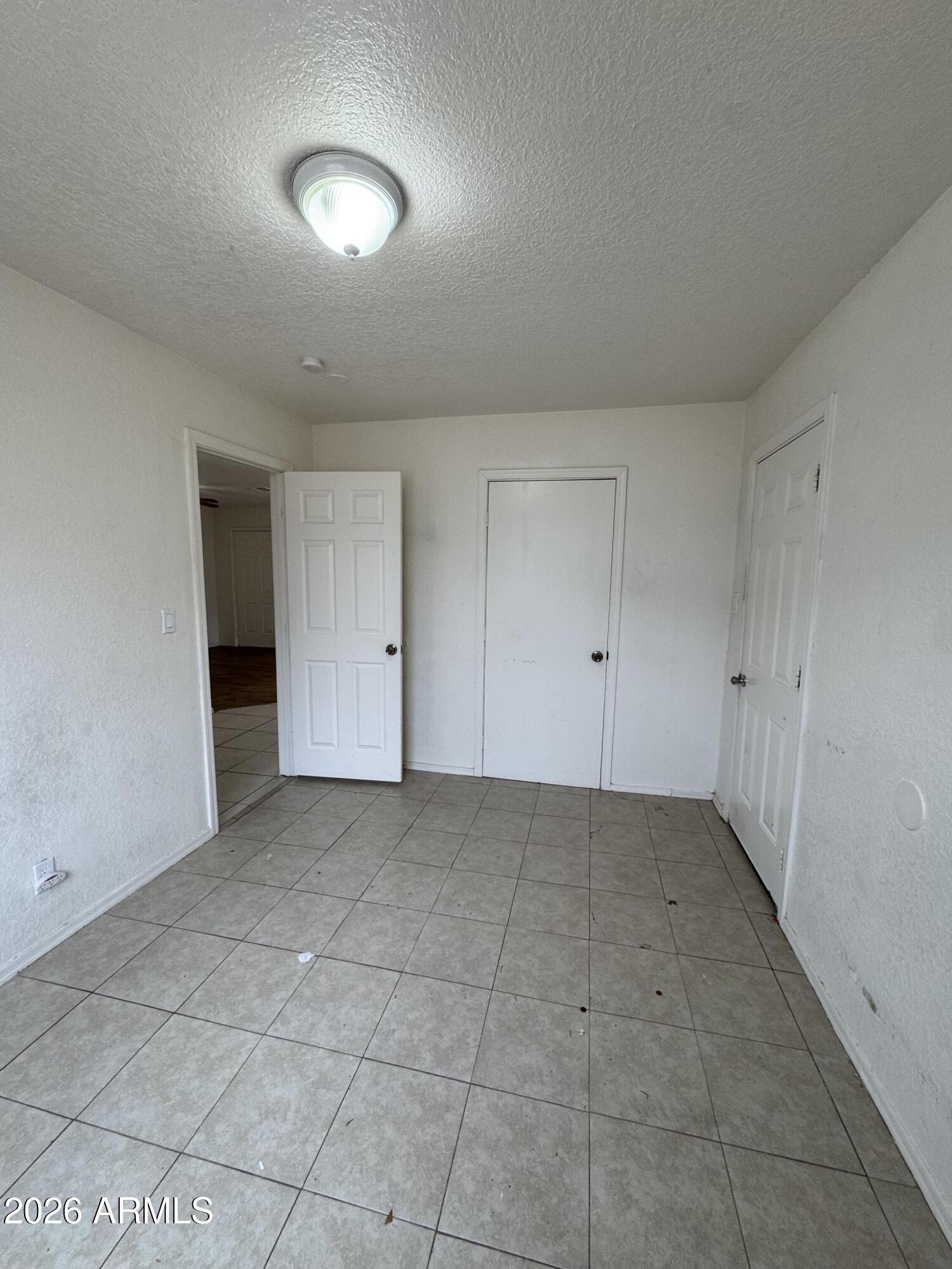 1702 West Shangri-la Road Phoenix, AZ 85029 - Photo 23 of 25 a view of an empty room with a fireplace