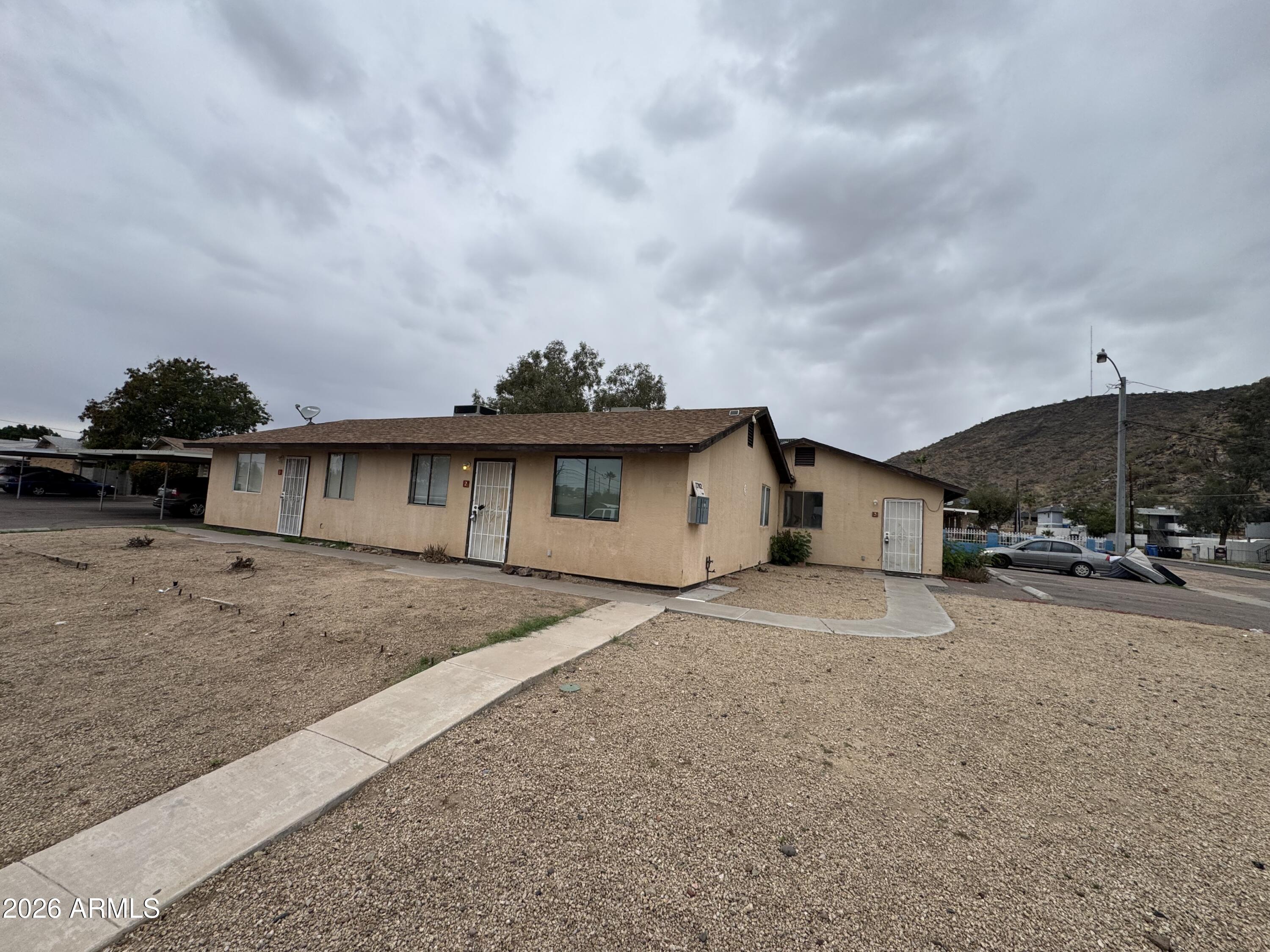 1702 West Shangri-la Road Phoenix, AZ 85029 - Photo 3 of 25 a view of a house with a patio