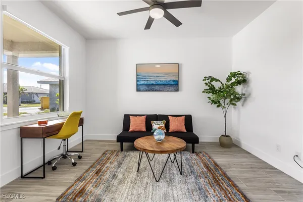 a workspace with furniture and a potted plant