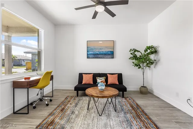 a workspace with furniture and a potted plant