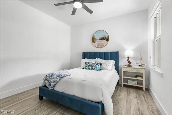 a bedroom with bed and a window