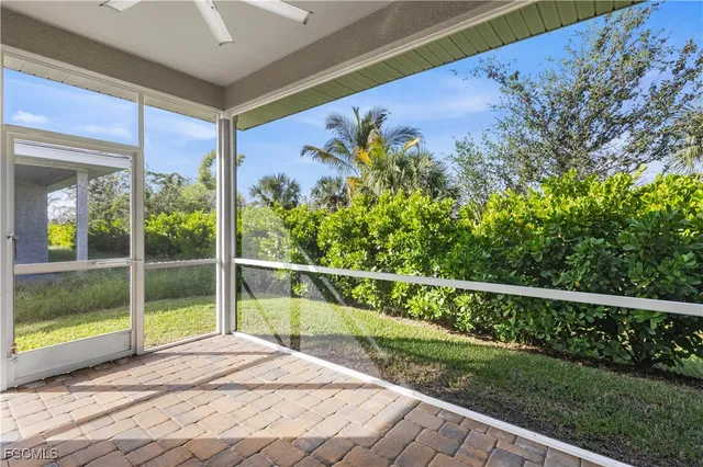 a view of a balcony with wooden floor and fence