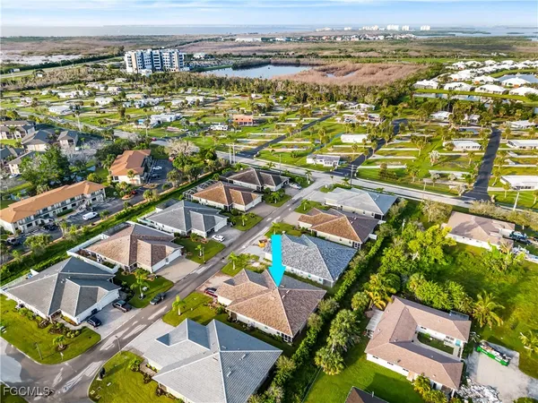 an aerial view of residential houses with outdoor space