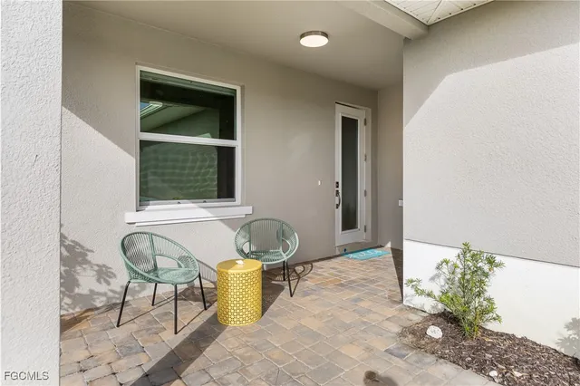 a living room with a couch and chairs