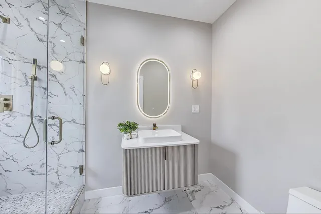 a bathroom with a sink and a mirror