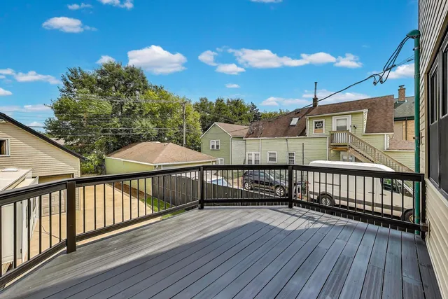 a view of a balcony with wooden floor