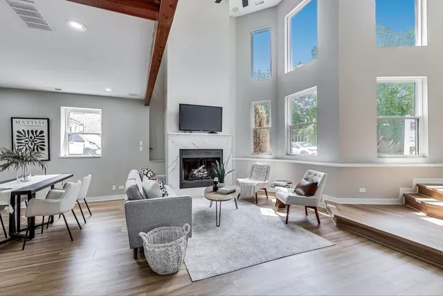a living room with furniture and a fireplace