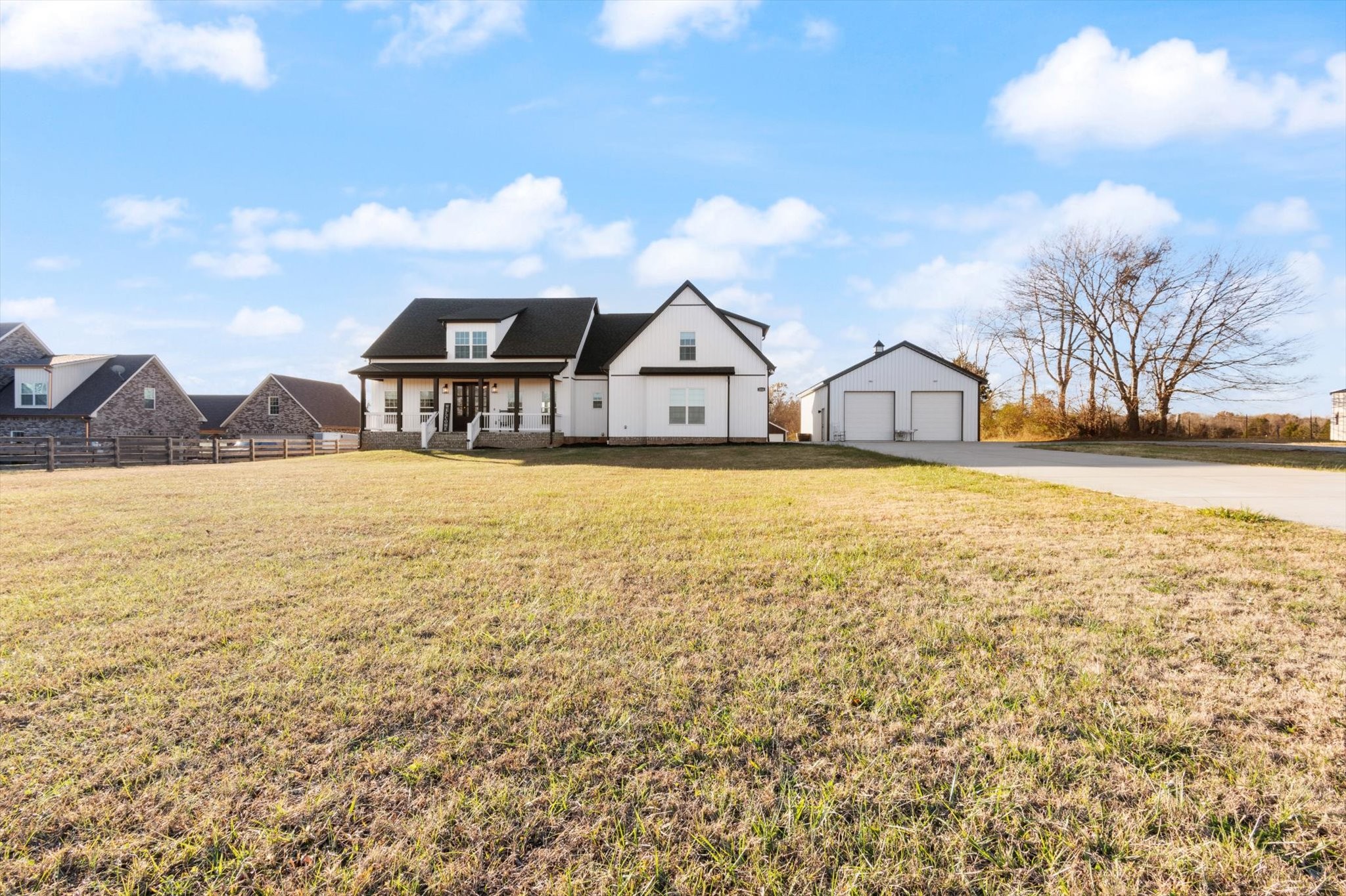 2114 Longview Road Rockvale, TN 37153 - Photo 2 of 48 a view of a house with a big yard and large trees