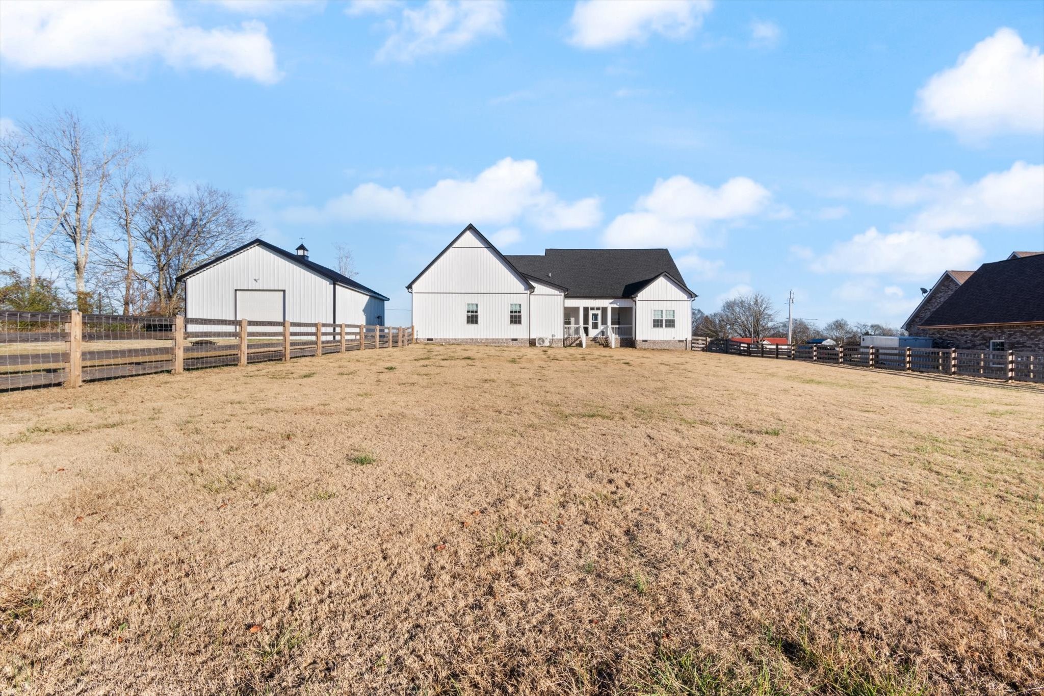 2114 Longview Road Rockvale, TN 37153 - Photo 10 of 48 a large house with a big yard and large trees