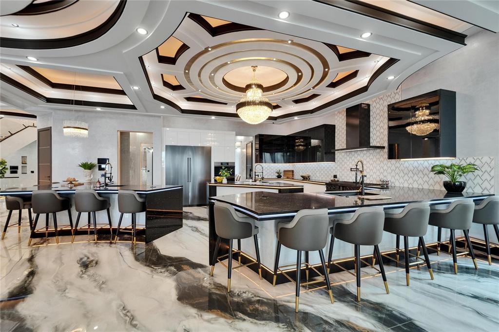 6526 Surfside Boulevard Apollo Beach, FL 33572 - Photo 20 of 99 a view of a dining area with furniture and a clock