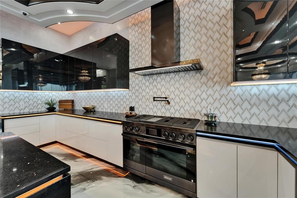 6526 Surfside Boulevard Apollo Beach, FL 33572 - Photo 23 of 99 a kitchen with stainless steel appliances granite countertop a stove and a sink