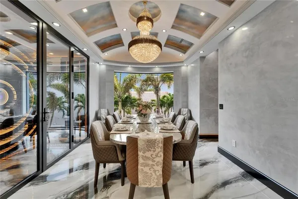 a kitchen with stainless steel appliances granite countertop a sink and a refrigerator
