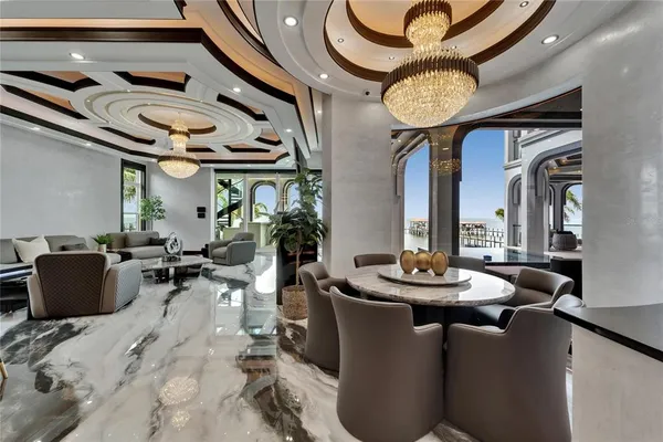 a kitchen with stainless steel appliances granite countertop a refrigerator and a more cabinets