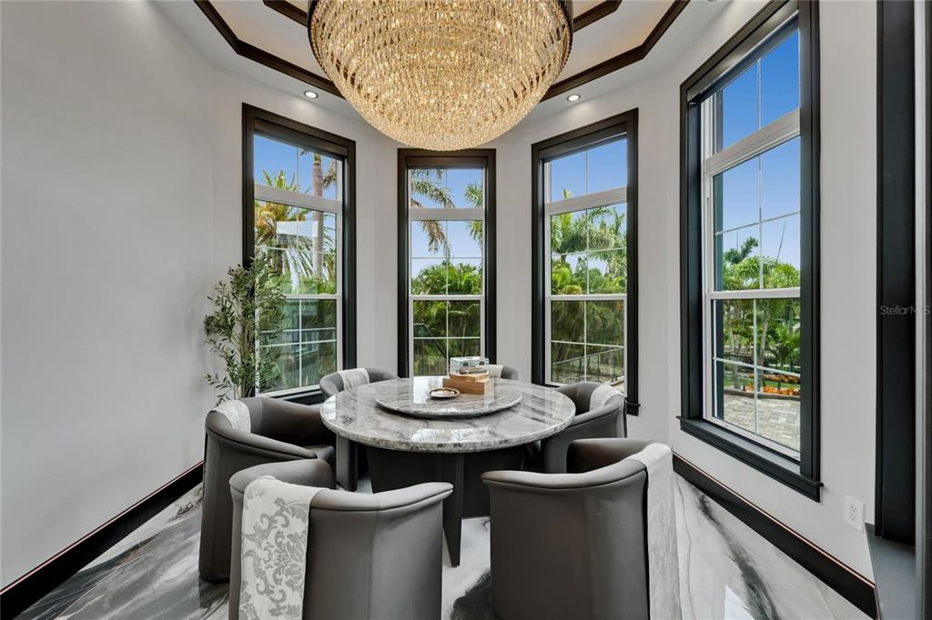 6526 Surfside Boulevard Apollo Beach, FL 33572 - Photo 37 of 99 a dining room with furniture and a window