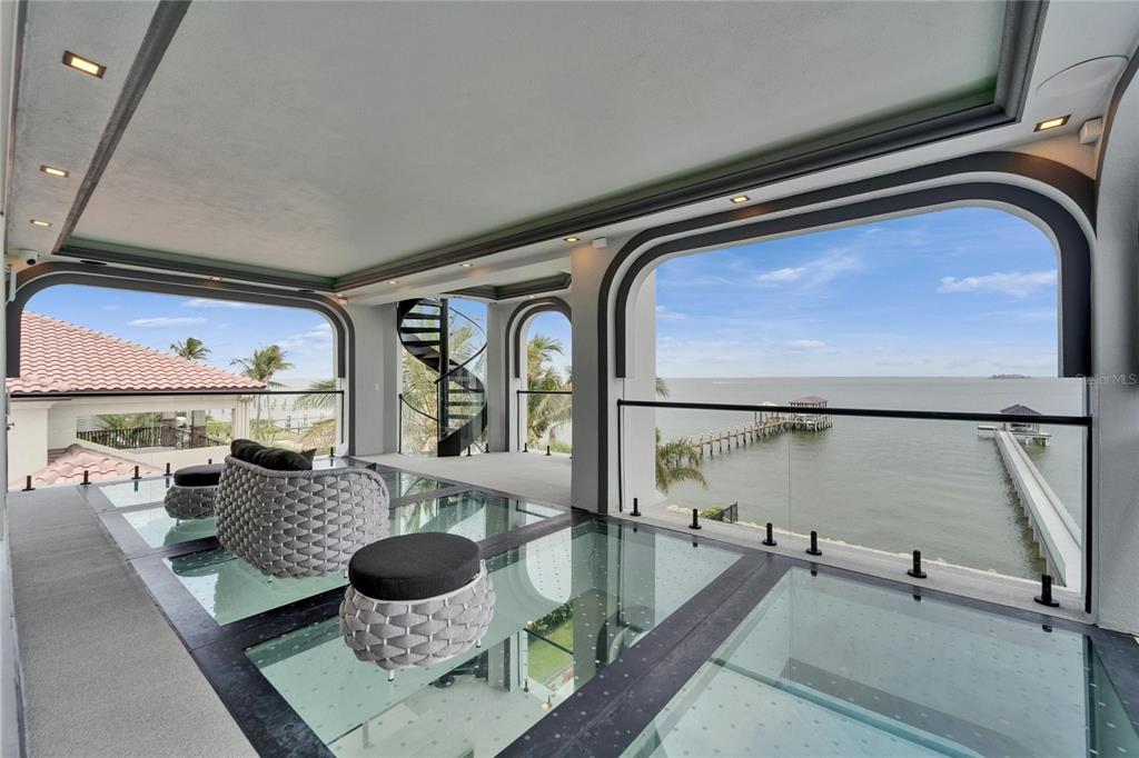 6526 Surfside Boulevard Apollo Beach, FL 33572 - Photo 59 of 99 a living room with furniture and a floor to ceiling window