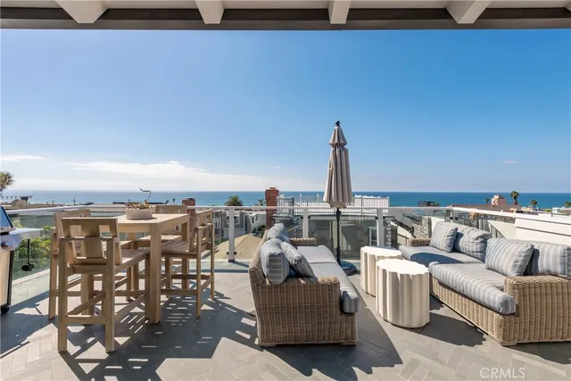 a view of roof deck with patio